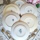 Antique earthenware dessert plates accompanied by a dish