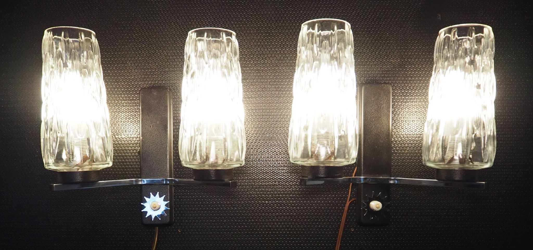 Pair of wall lights from the 1950s-1960s with a push button switch.