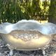 Footed pewter champagne cooler on claw feet with floral relief