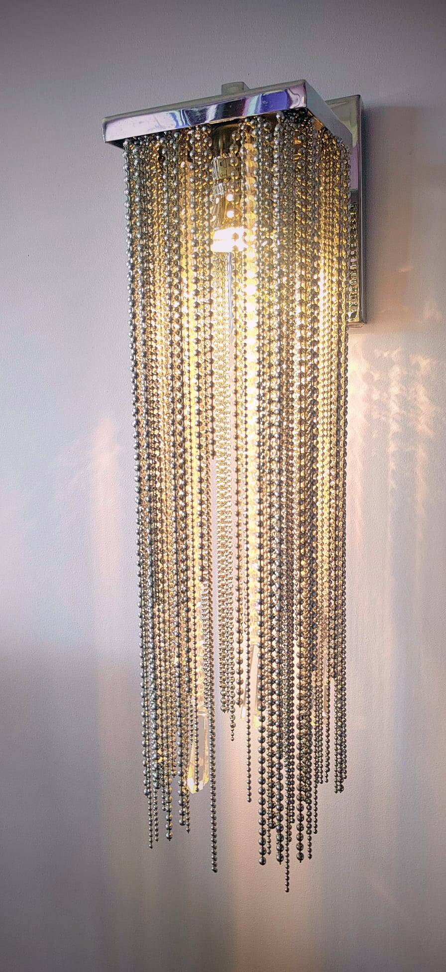 Swarovski wall lamp in silver-plated metal with crystal pendants.