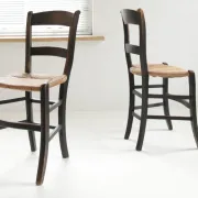 Pair of antique Northern French black-stained chairs with rush seats