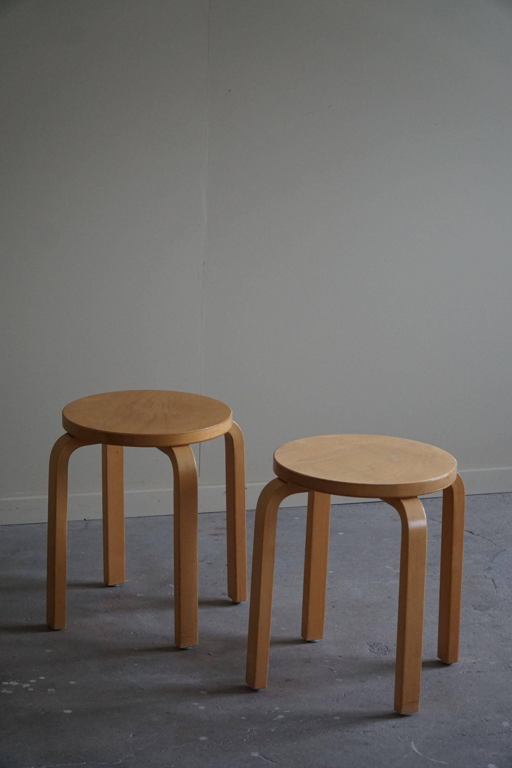 Alvar Aalto, a pair of vintage birch stools, model "60", made by Artek, 1970s.