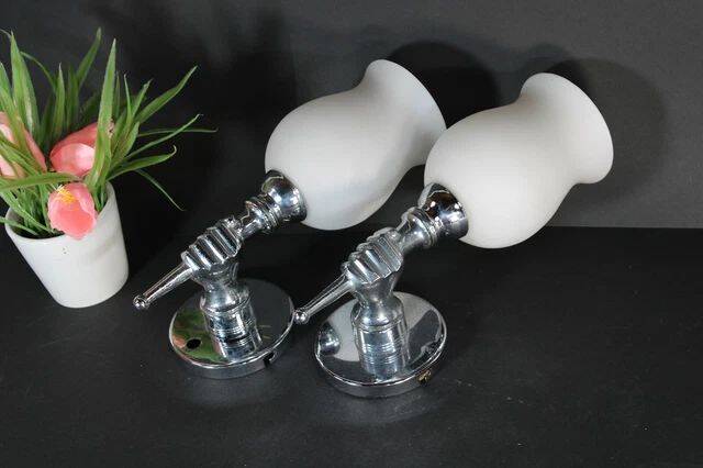 Pair of chrome-plated metal wall lights, hand-shaped with lampshade