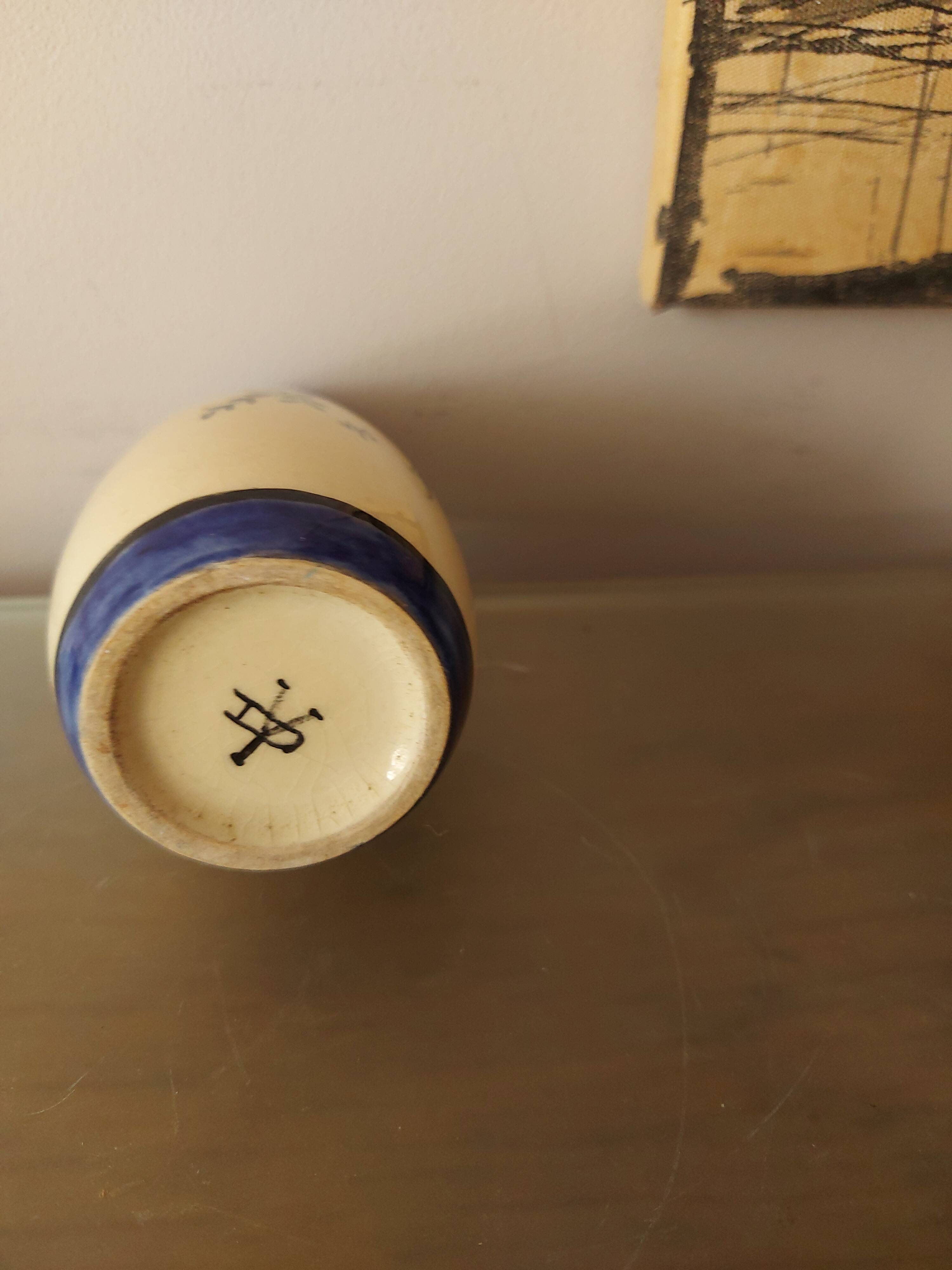 Signed art deco vase, bird of paradise décor