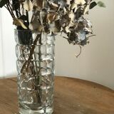 Multi-faceted moulded glass vase.