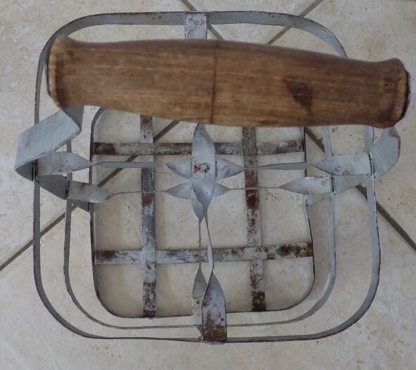 Antique metal bottle holder with wooden handle