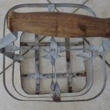 Antique metal bottle holder with wooden handle