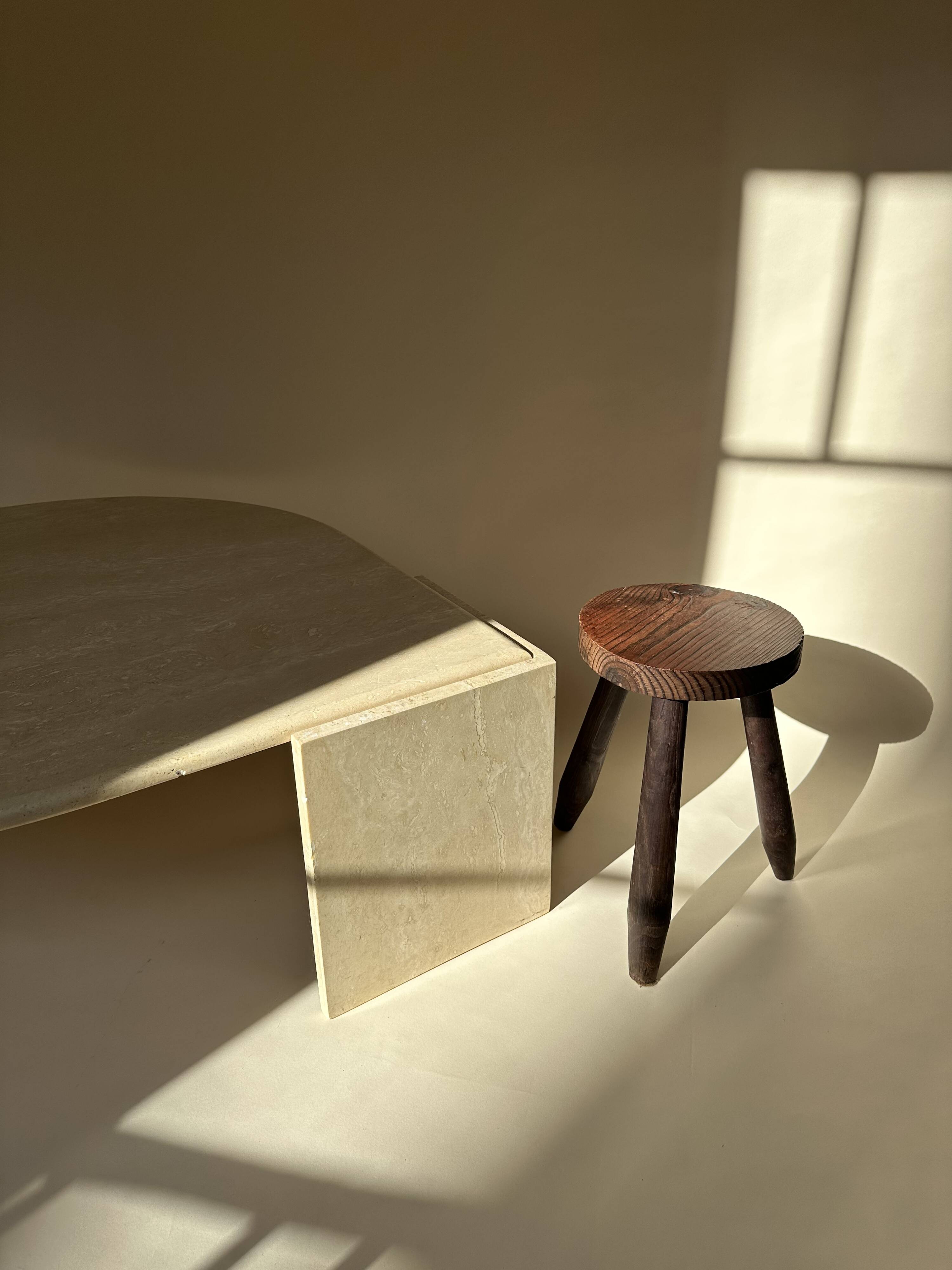 Travertine eye-shaped coffee table