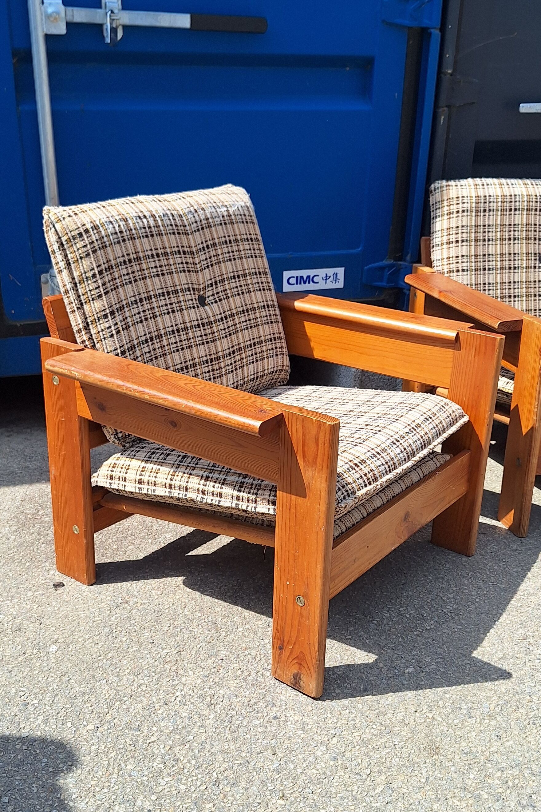 Brutalist-style bench and armchairs in 1970s pine.