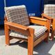 Brutalist-style bench and armchairs in 1970s pine.