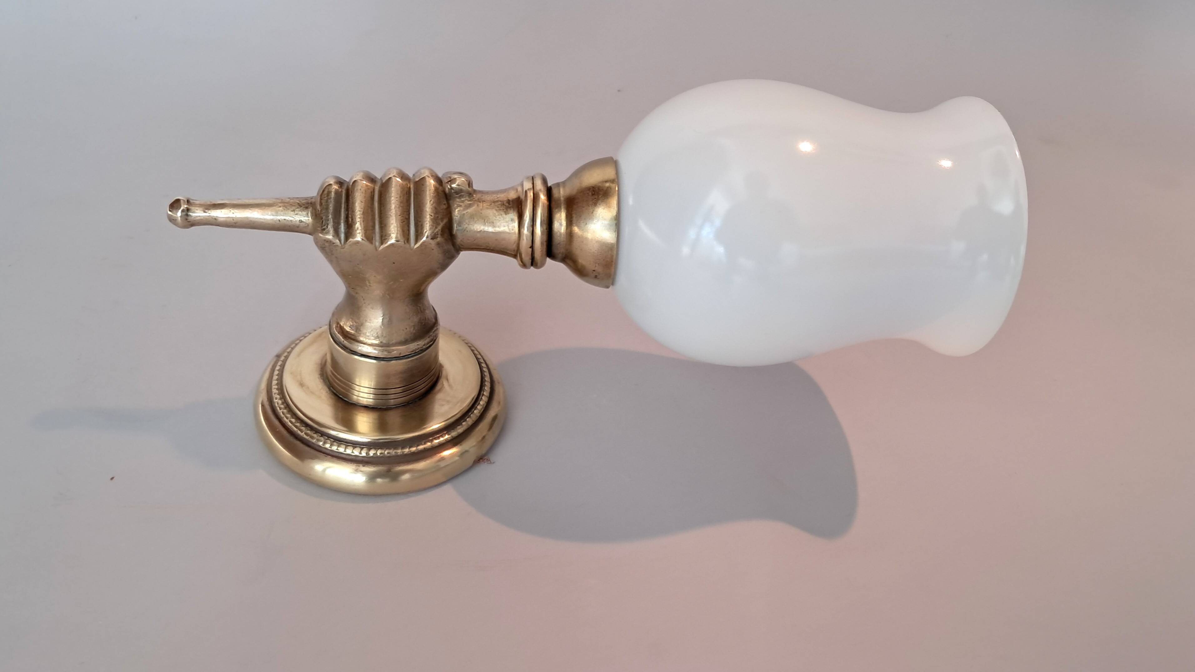 Golden brass wall light from the 1950s.