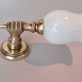 Golden brass wall light from the 1950s.