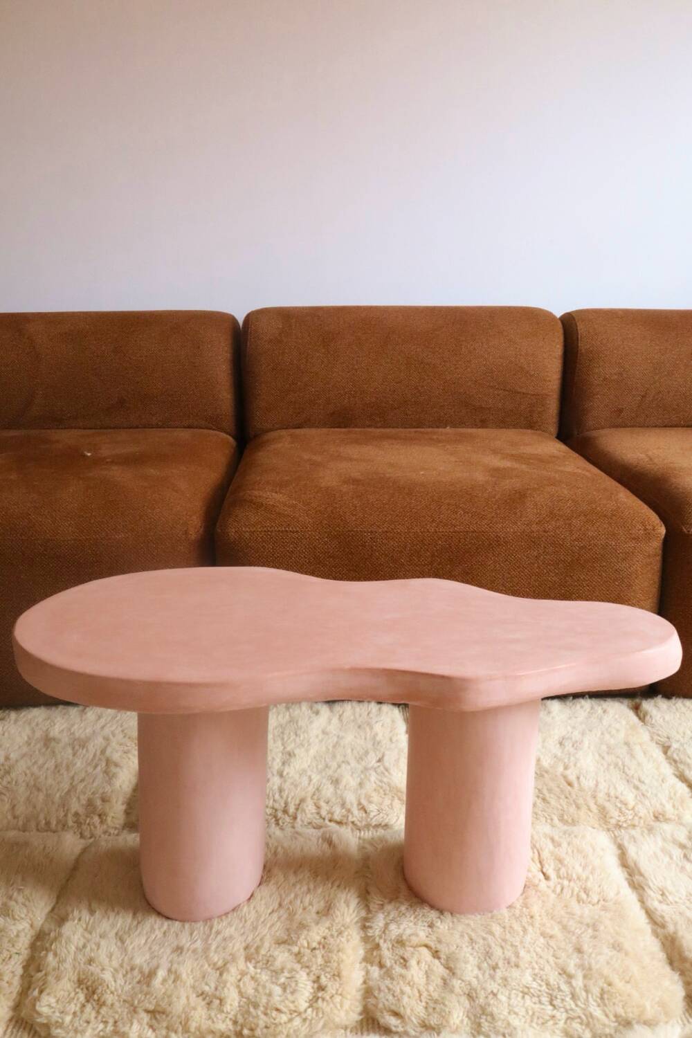 Organic shaped coffee table in pink teracotta tadelakt