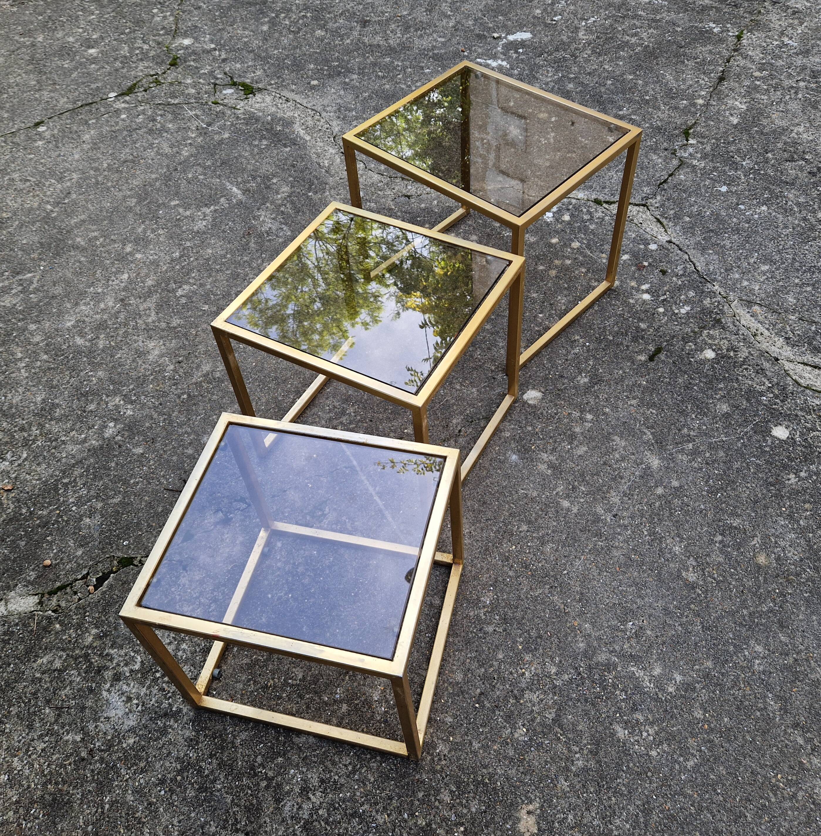 Vintage 1980s gold metal and smoked glass nesting tables