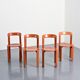 Rey chairs in stained red beech by Bruno Rey