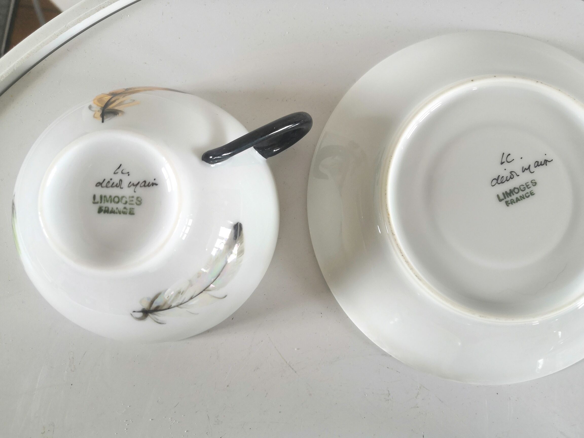 4 cups and cups in fine Limoges porcelain signed LC 60s