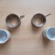 2 porcelain coffee cups with cup holder and metal tray