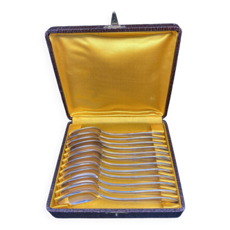 Dessert spoons in silver-white metal