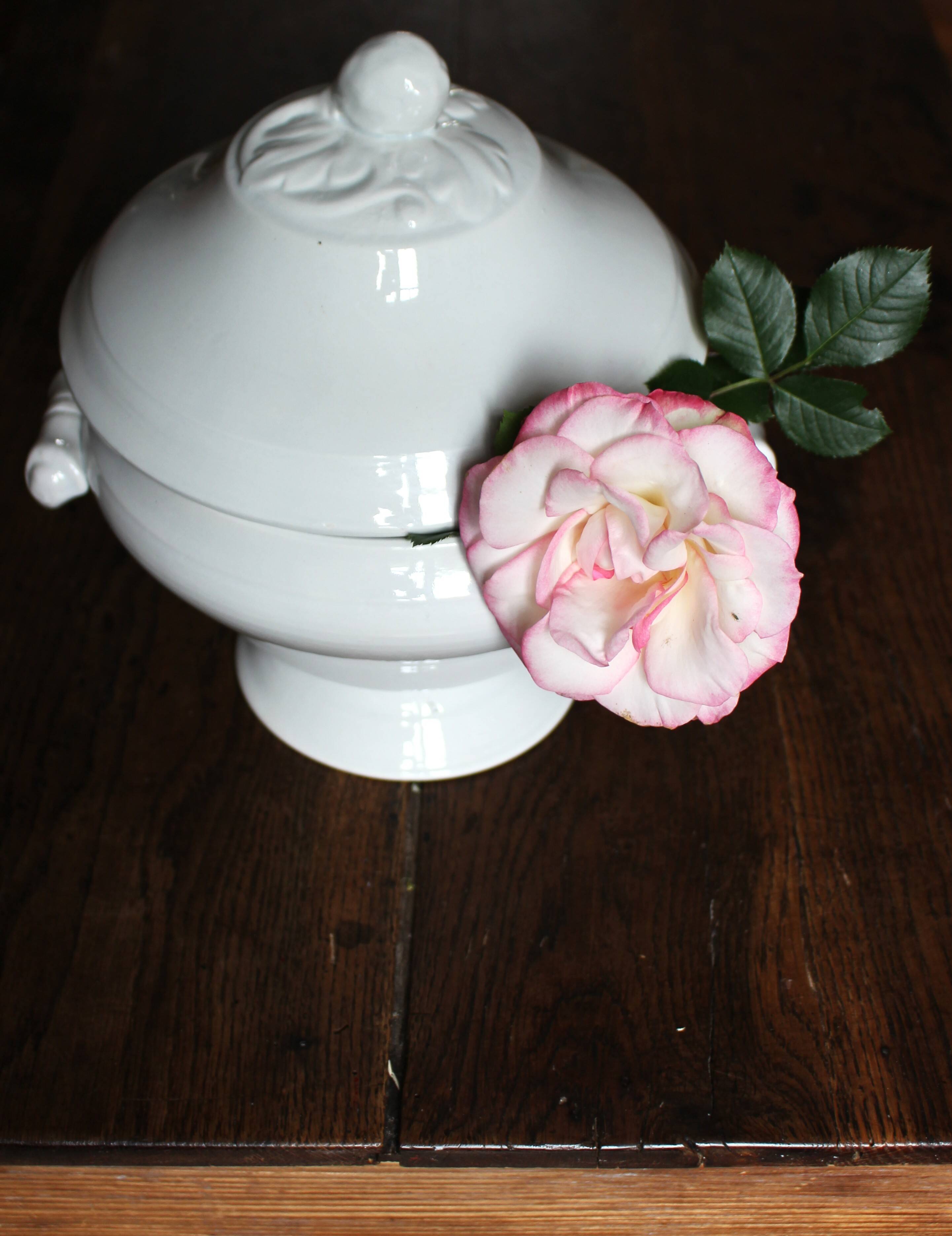 Antique soup tureen, white earthenware, with stopper decoration.