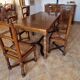 Marquetry wooden dining table with its 6 chairs.