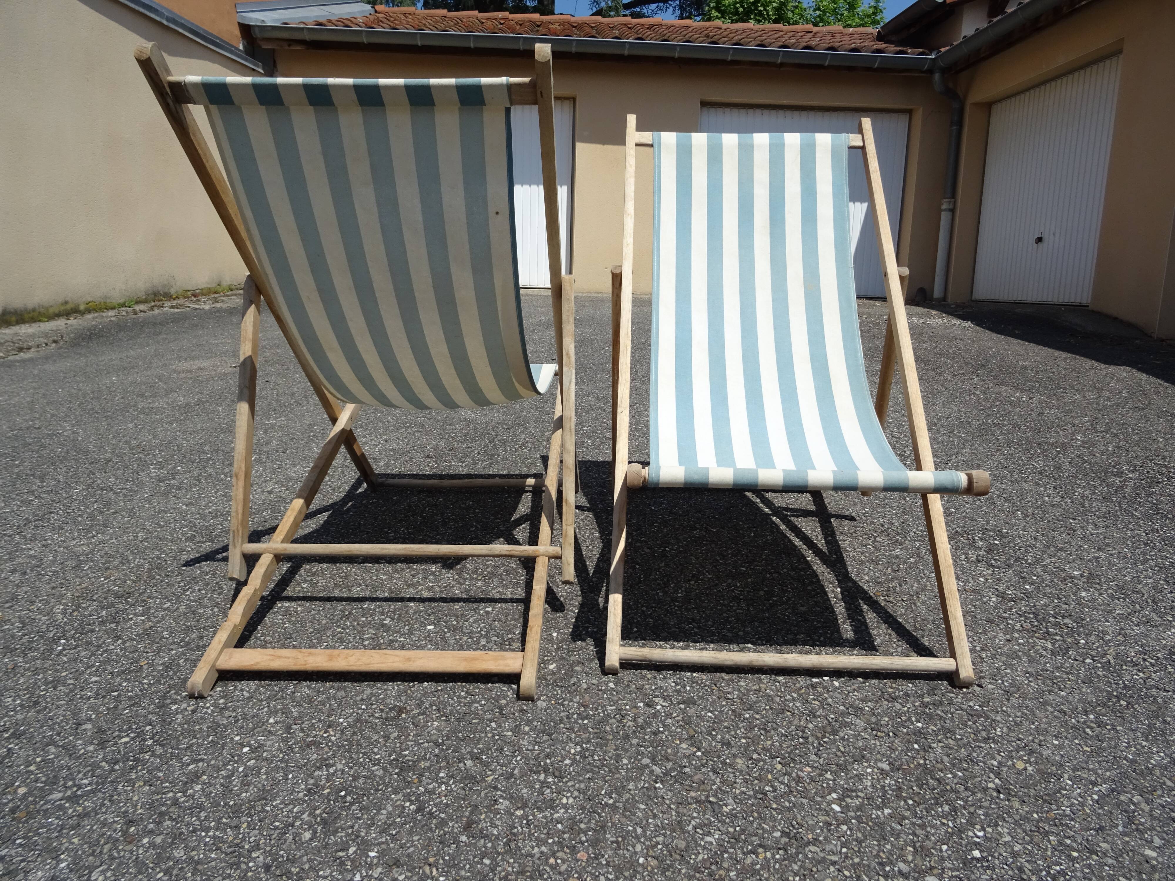 Pair of sun loungers with vintage blue blue stripes