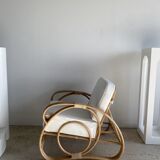 Large rattan rest chair and white cushions