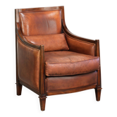 Fauteuil Art Déco en peau de mouton avec un siège confortable et des couleurs chaudes.