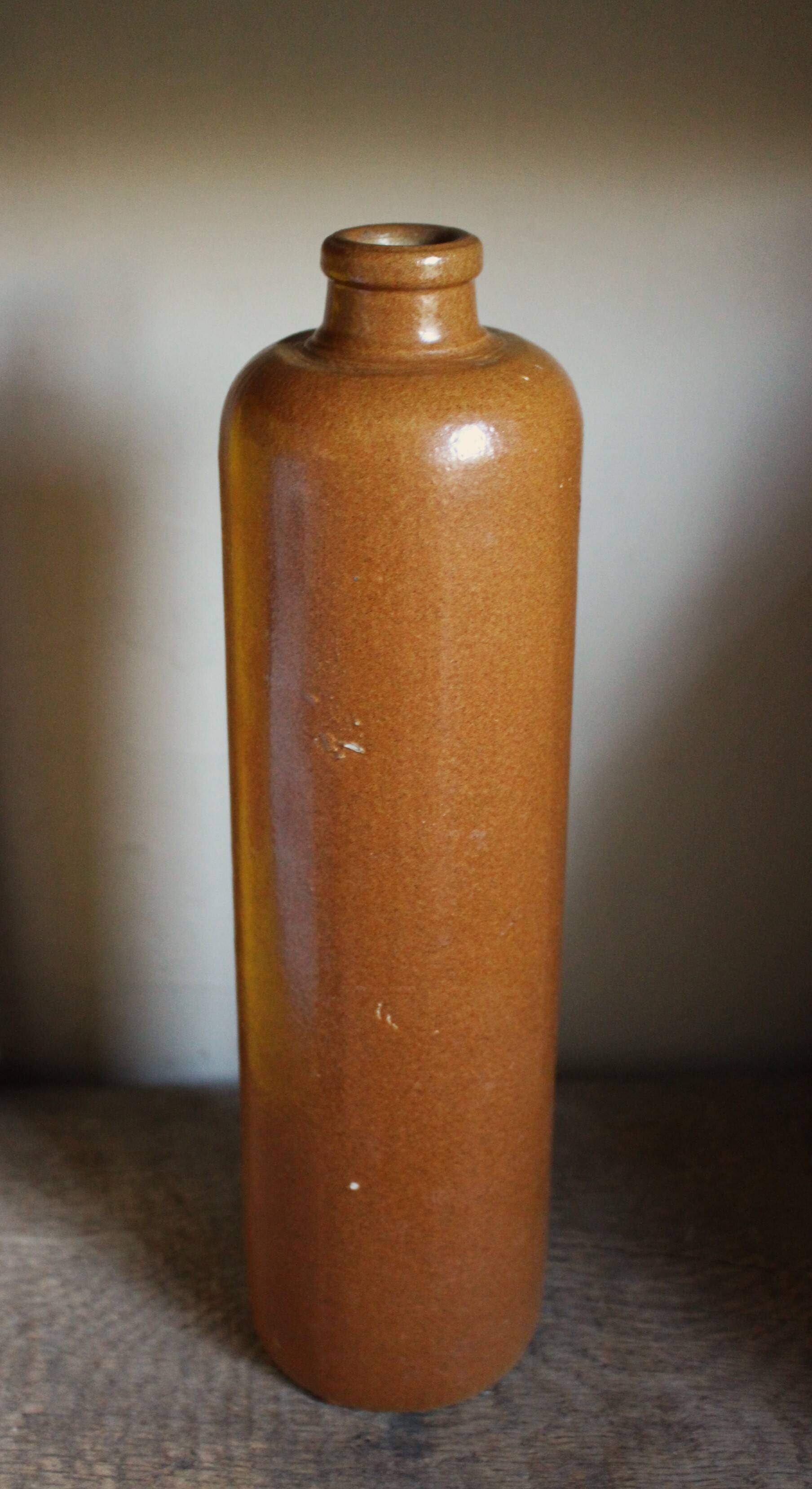 Large antique vintage stoneware liqueur bottle