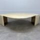 Table basse travertin forme œil par Roche Bobois