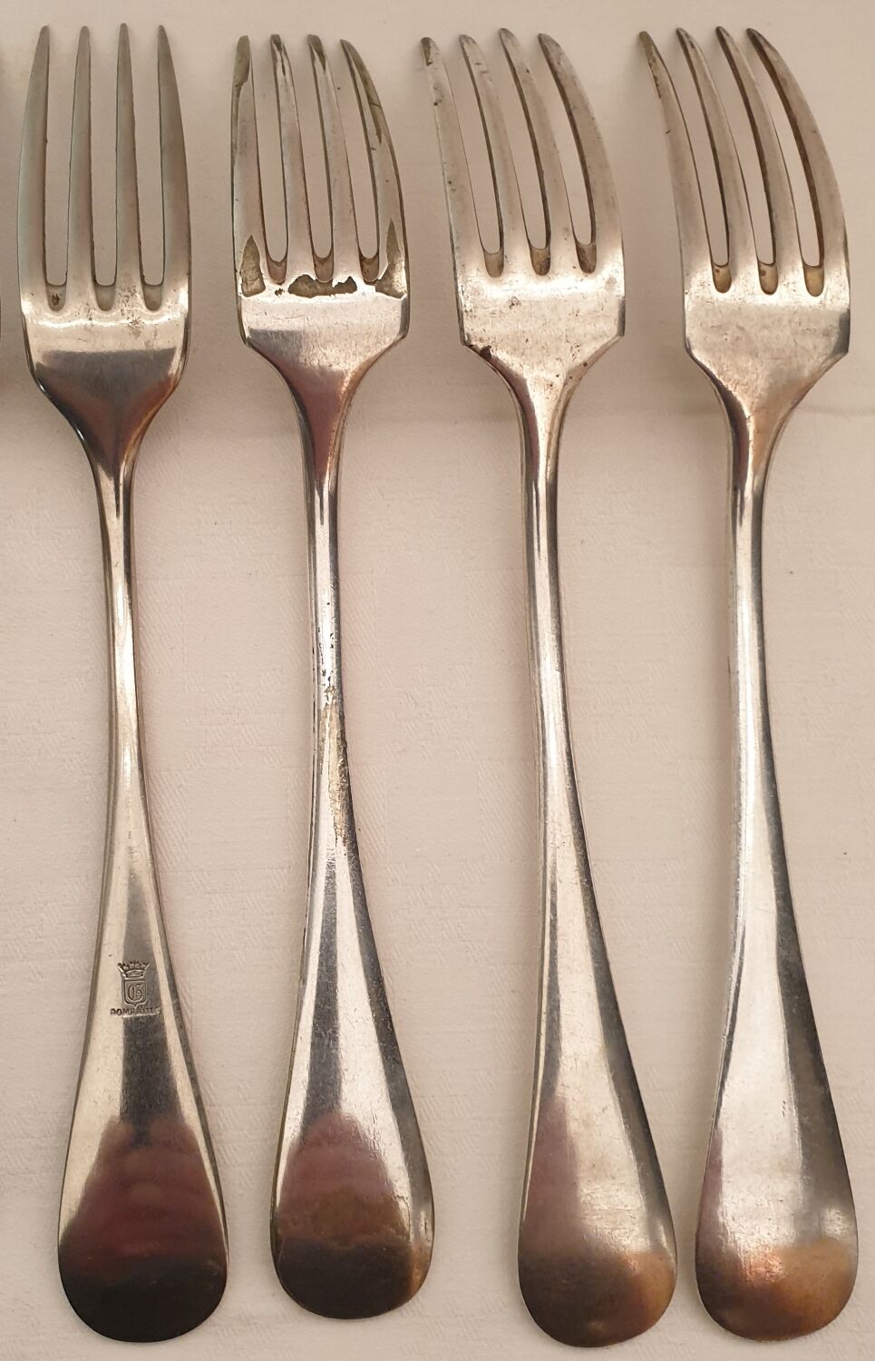 10 mismatched silver metal forks