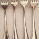 10 mismatched silver metal forks