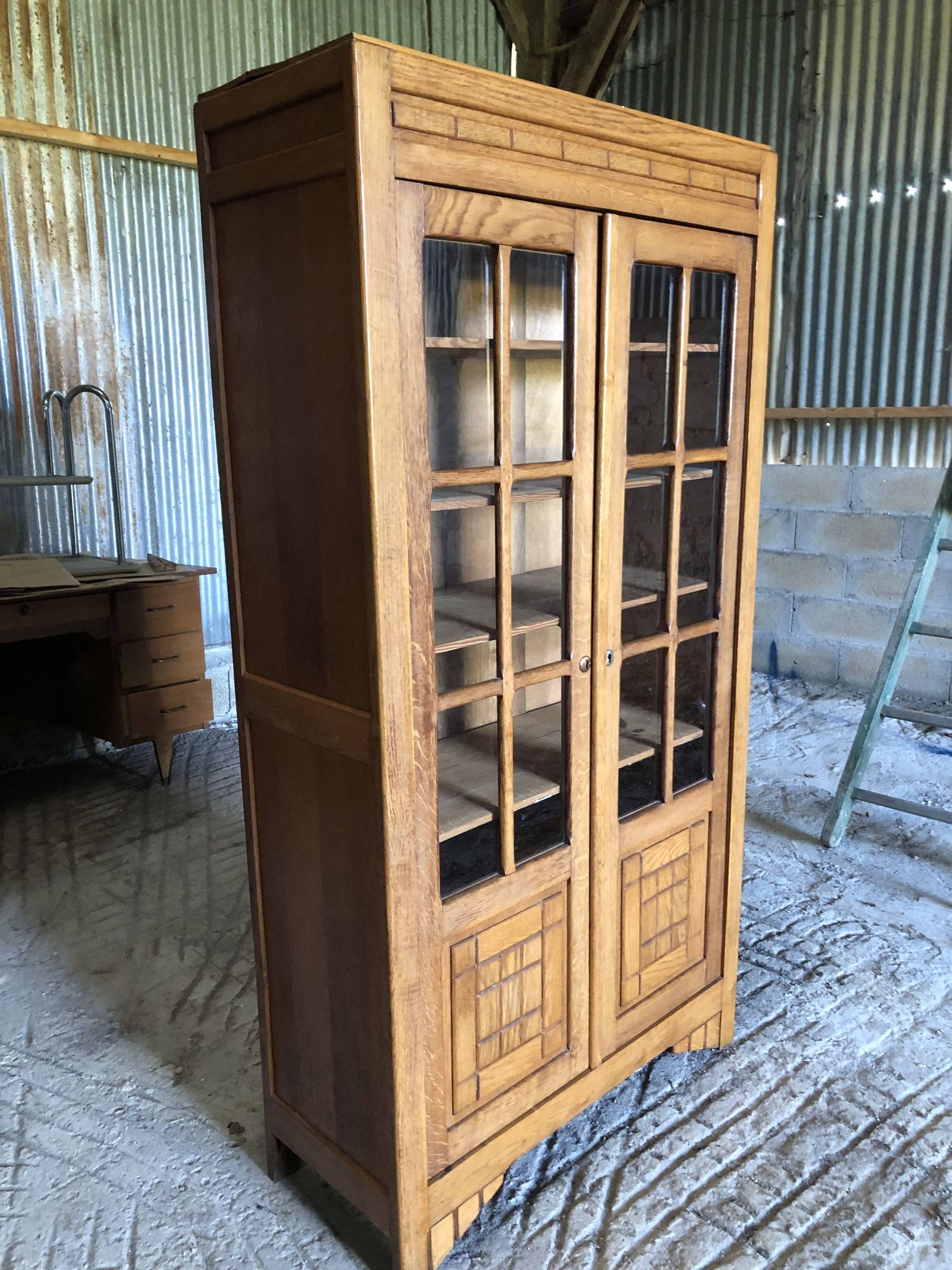Vintage oak bookcase from the reconstruction period with 2 doors with small panes.
