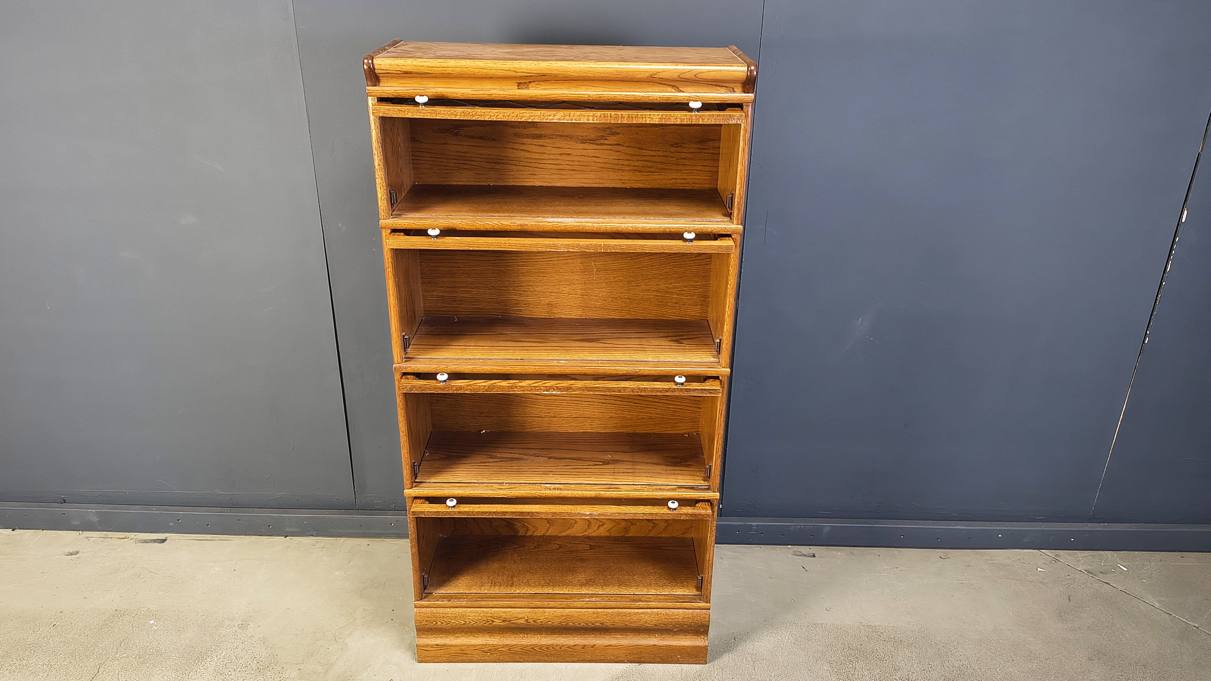 Four tier oak barrister style bookcase with leaded glass