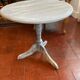 Patinated wooden pedestal table