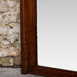 Beveled mirror in carved oak early twentieth century