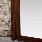 Miroir biseauté en chêne sculpté début XXème