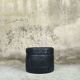 Vintage De Sede black leather storage pouf.