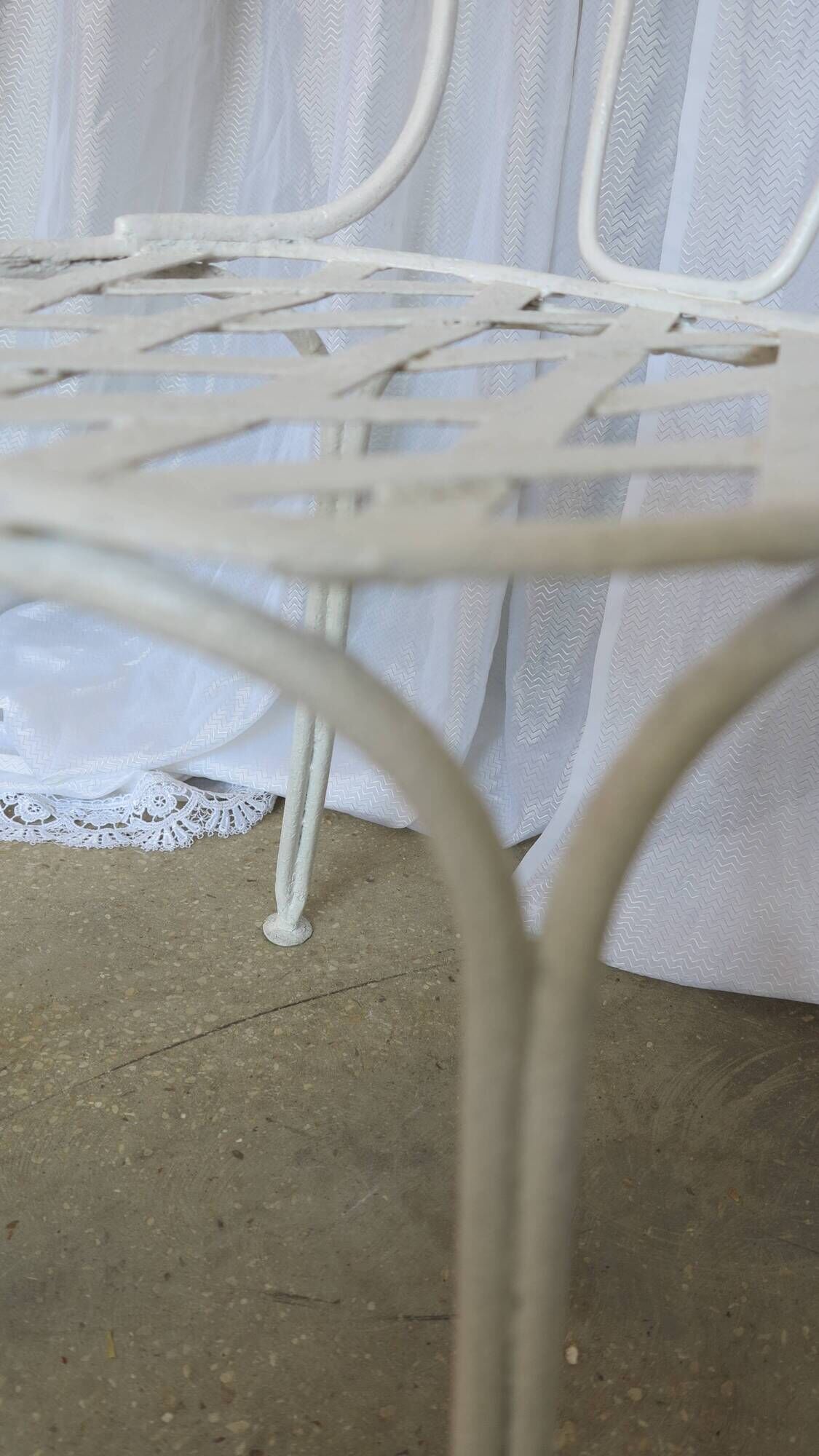 Pair of antique garden chairs, wrought iron, white paint.