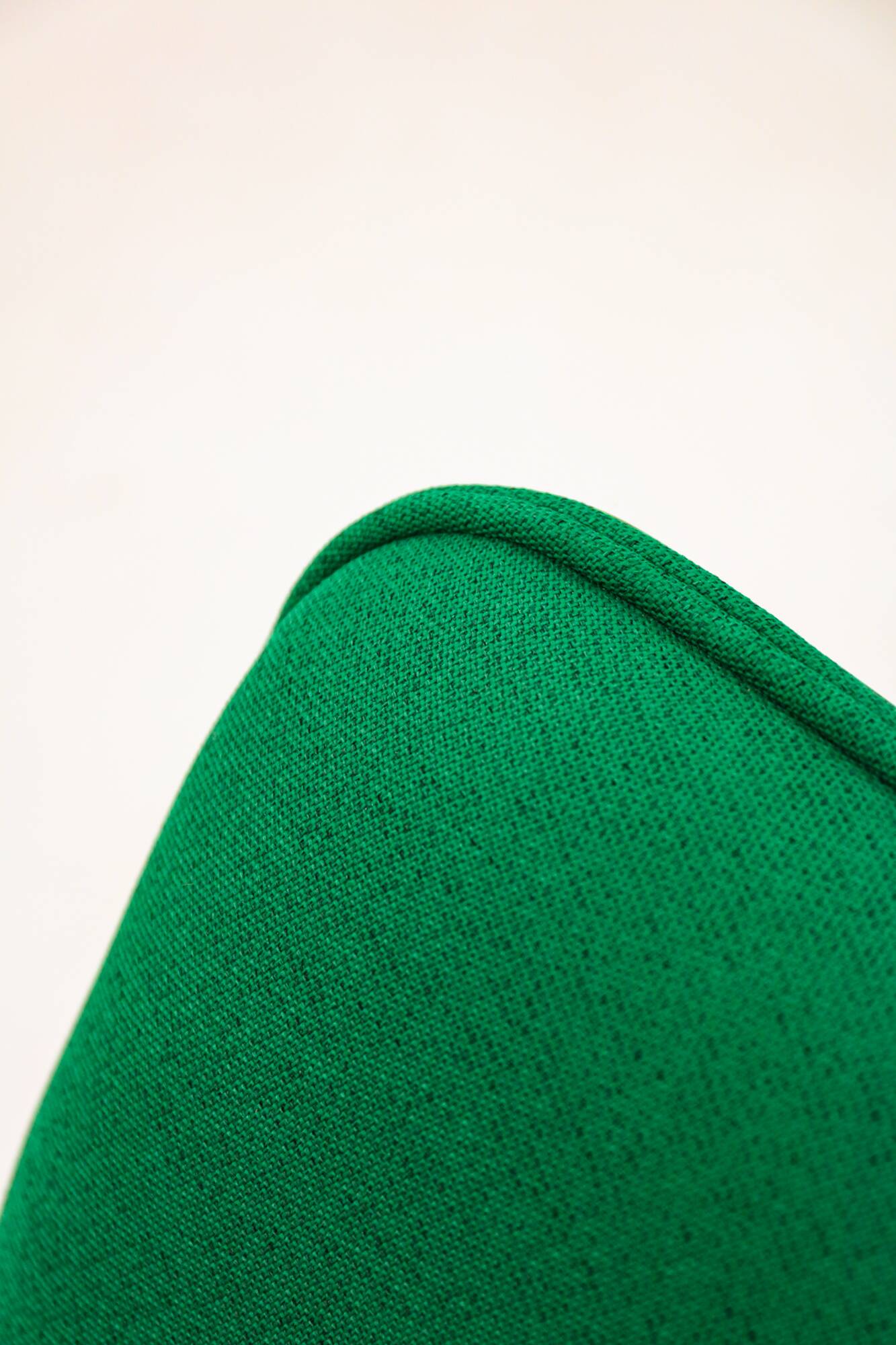 Green Artifort armchair, design by Geoffrey Harcourt.