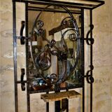 Wrought iron wardrobe with oval mirror