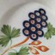 Pair of antique soup plates with hand-painted grape decoration