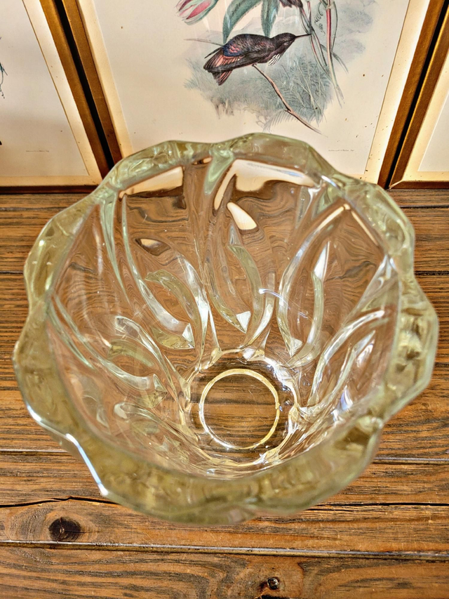 Vintage thick glass vase with twisted ribbed relief.