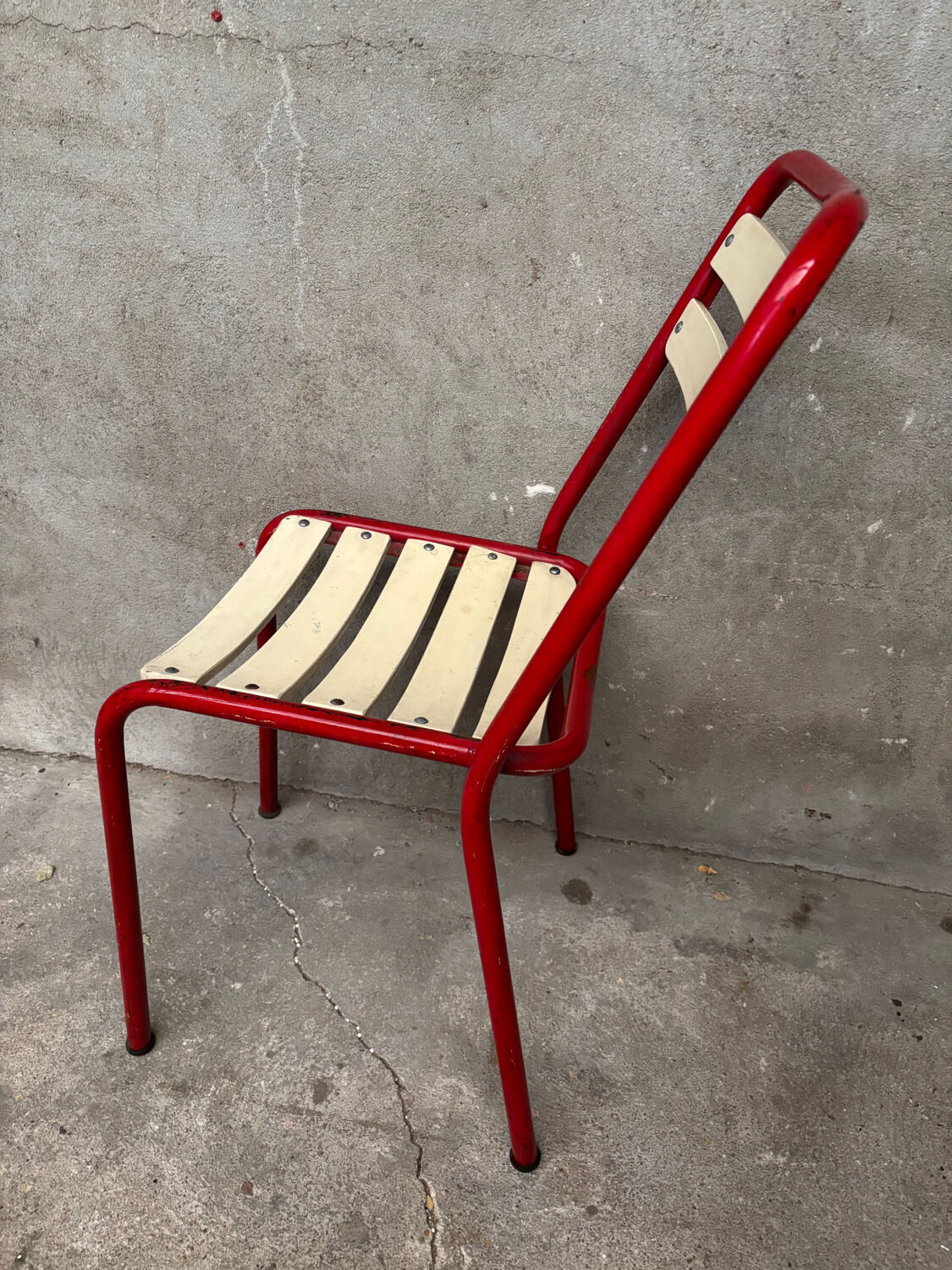 Red and white Tolix chair