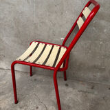 Red and white Tolix chair