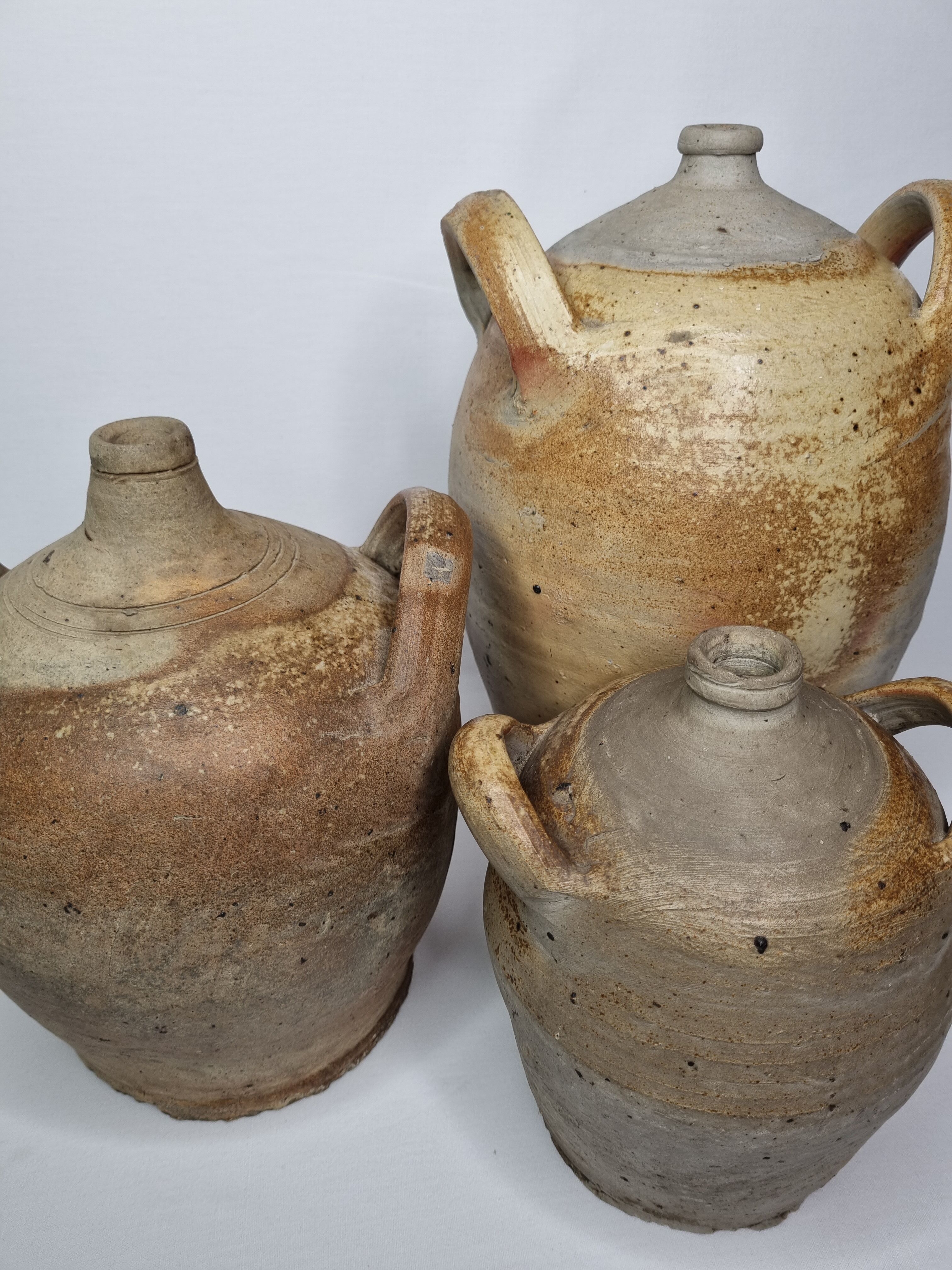 Set of three ancient ladies-jeannes in enamelled terracotta