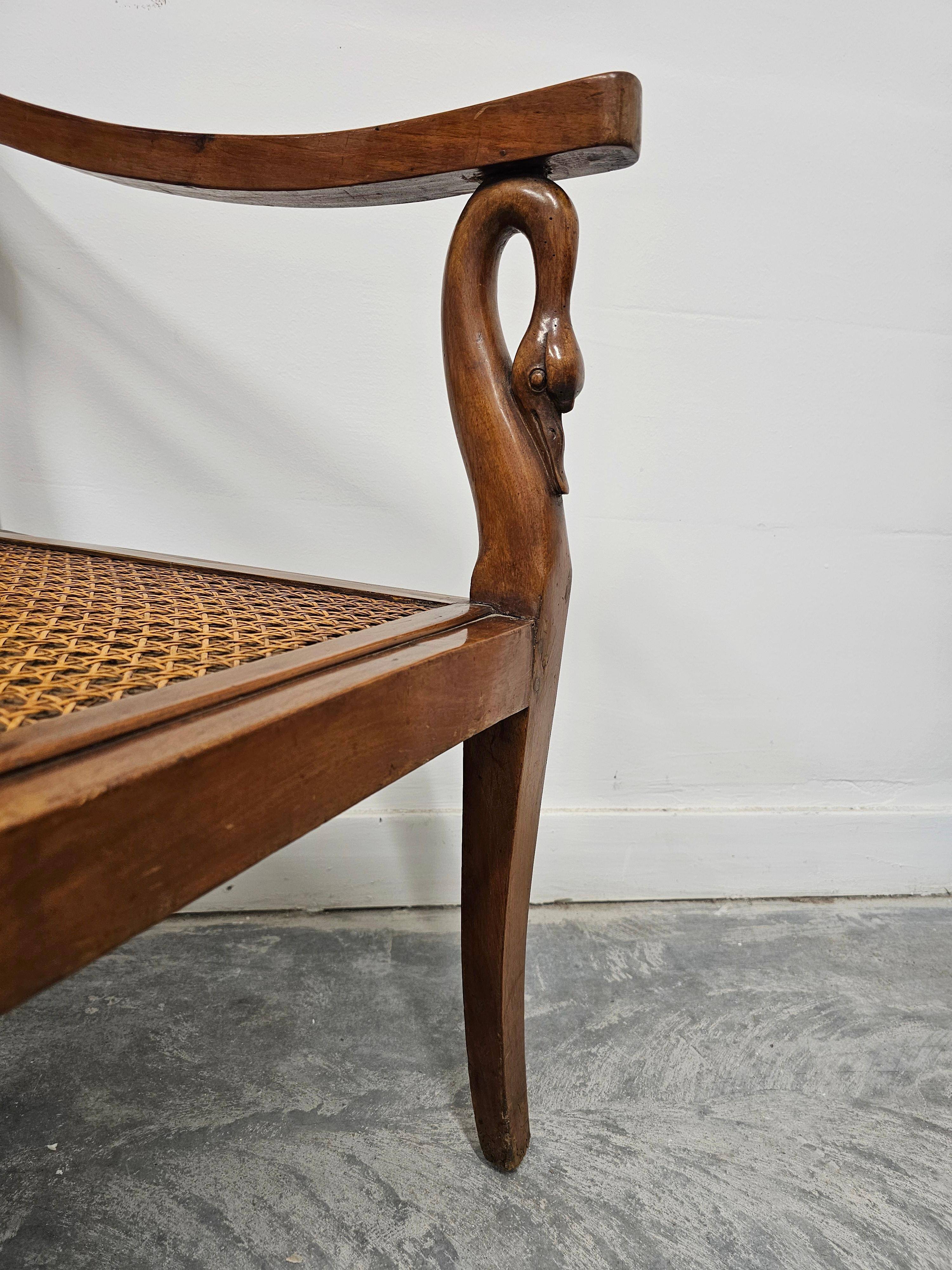Directoire canapé in walnut with brass inlays, late 18th century.