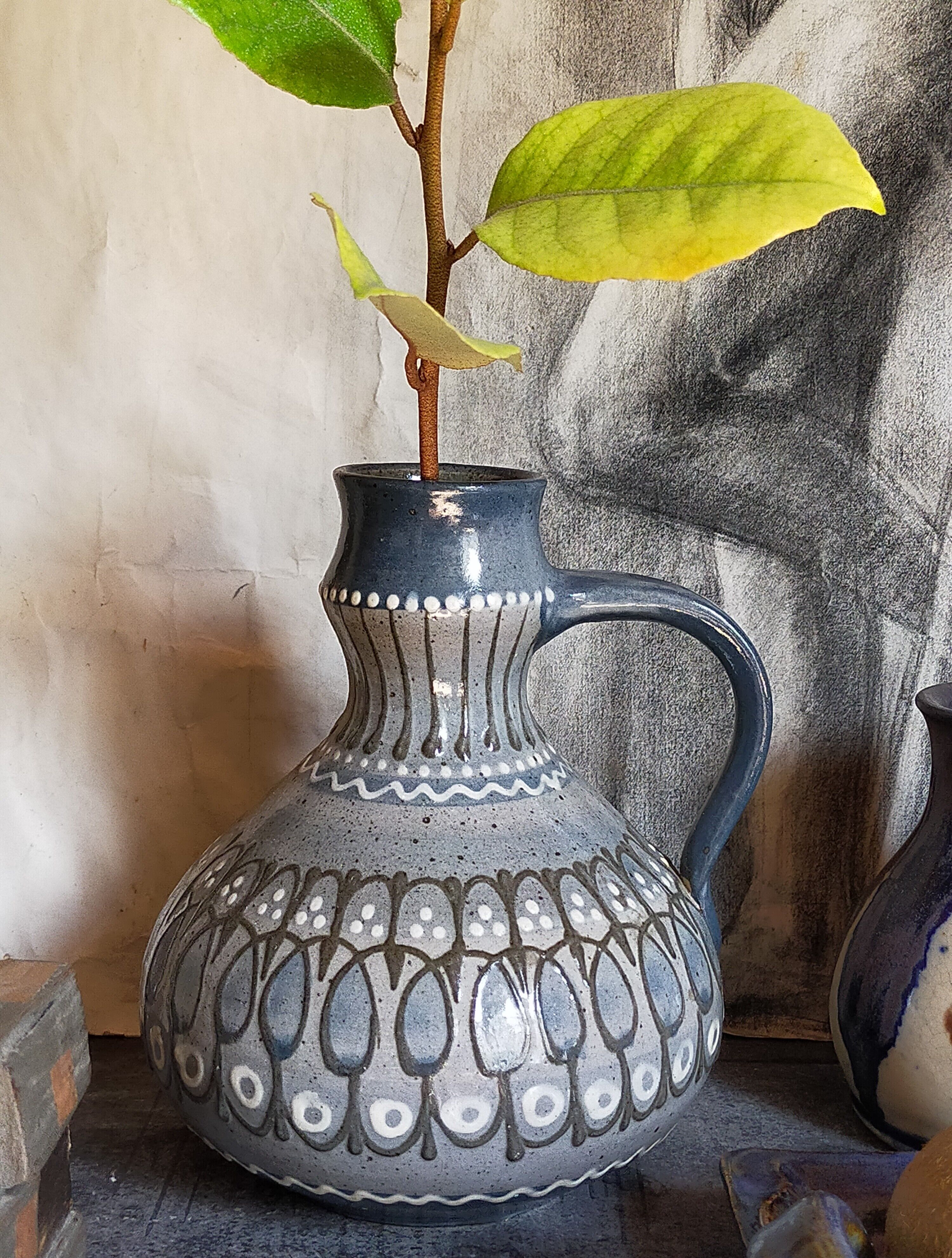 Ceramic handle vase with vintage graphic decoration