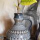 Ceramic handle vase with vintage graphic decoration