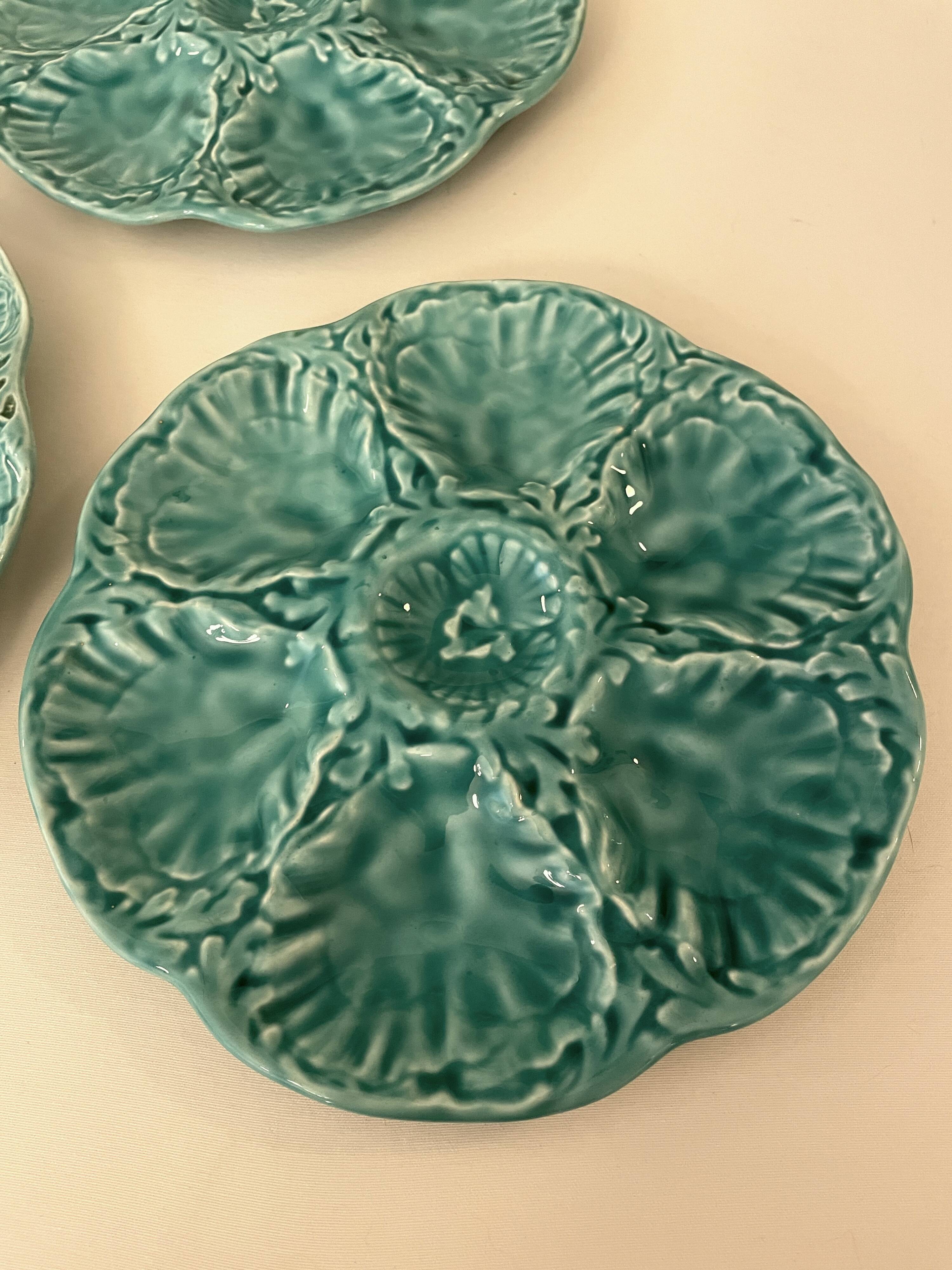 Dish and 4 turquoise faience oyster plates from Gien, France.