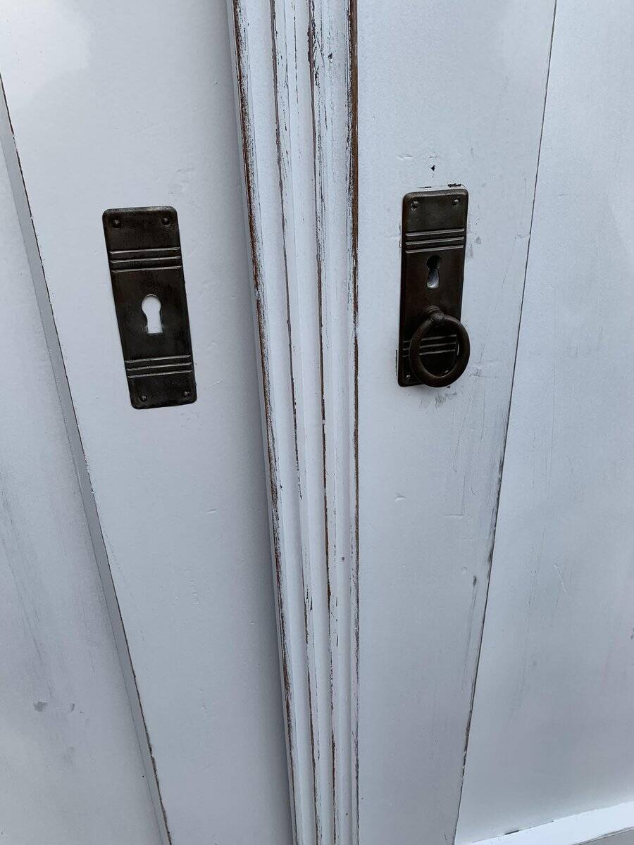 Vintage two-door wardrobe in painted white wood — late 19th century Hungarian style.